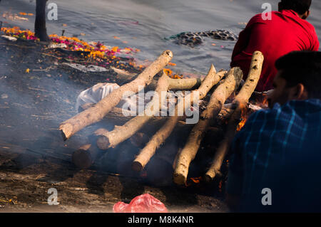 VARANASI, INDIA. February 28, 2017: Dead body burning in a funeral pyre. The ancient Indian tradition Stock Photo