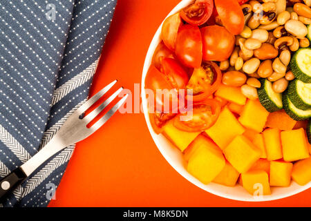Healthy Vegan Or Vegetarian Sweet Potato And Beans Hawaiian Stlye Buddha Bowl Against A Red Background Stock Photo