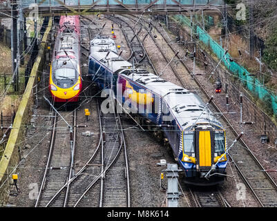 Scotrail passenger train and Virgin Trains train and tracks at  Waverley Station in Edinburgh, Scotland, United Kingdom Stock Photo