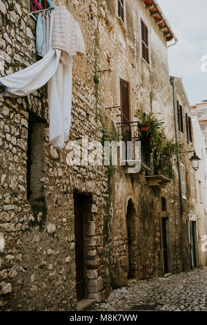 Clothes hanging outside in narrow Italian streets of Sermoneta Stock Photo