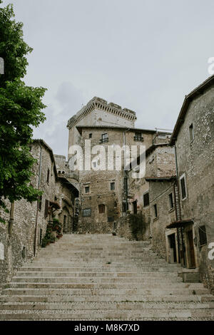 Via delle Scalette street of Sermoneta with view of the Castle Stock Photo