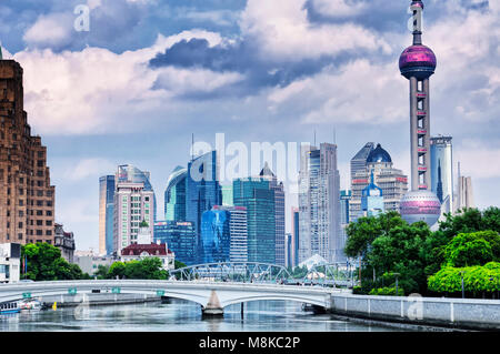 July 15, 2015.  Shanghai, China. The Waibaidu (garden) and Huqiu Road bridges over the Wusong River (Suzhou Creek) with the modern buildings of Lujiaz Stock Photo