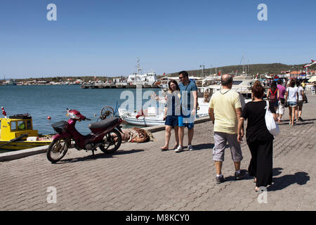 People walk by seaside in Cunda (Alibey) island. Stock Photo