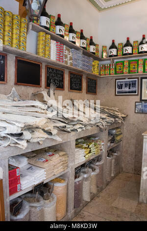 Tiny shop selling Bacalhau (dried, salted cod), Lisbon, Portugal Stock Photo