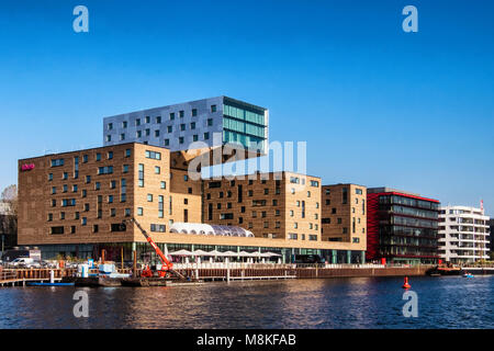 Berlin-Friedrichshain.NHow Modern hotel inext to Spree river with our own music studios and recording booth,riverside bar Stock Photo