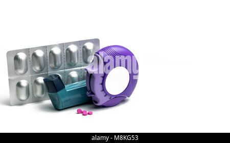 Set of asthma inhaler, accuhaler and anti-allergy pills for treatment asthma. Asthma controller, reliever equipment on blue table with copy space. Bro Stock Photo