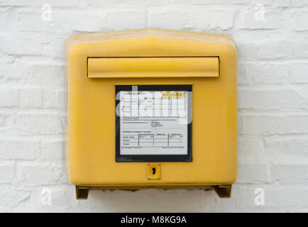 Yellow Deutsche Post Letterbox Stock Photo