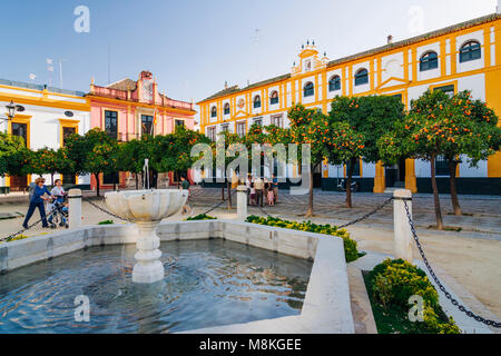 Seville, Andalusia, Spain : People walk trough square in traditional Santa Cruz district. Stock Photo