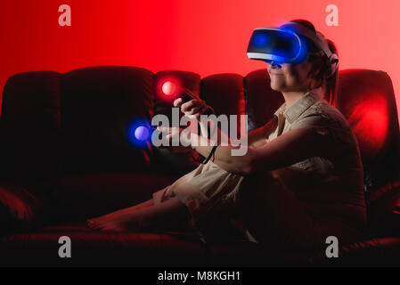 Woman playing in virtual reality Stock Photo