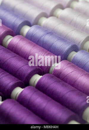 background thread spools purple, violet, lilac close-up Stock Photo