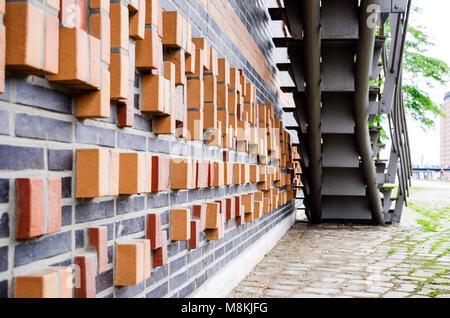 Orange and black cinder block walls in Hamburg, Germany. Stock Photo