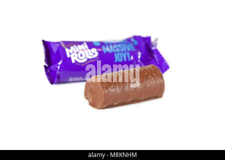 Cadburys chocolate mini roll with wrapper on isolated white background Stock Photo
