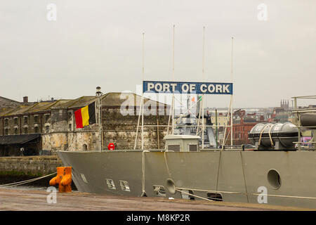 The Belgian National flag flying on the vessel Tridens at Kennedy Wharf in Cork City Harbour during a slight snow storm Stock Photo