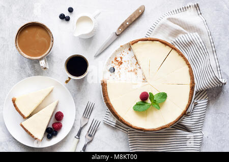 Classic New York Cheesecake And Coffee on White Concrete Background, Top View. Coffee and Cheesecake Stock Photo