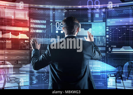Progressive specialist using virtual reality while working with programs Stock Photo