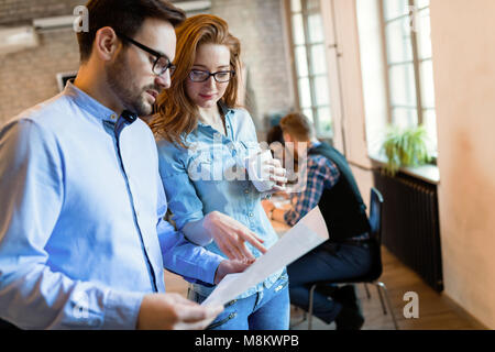 Business people and architects collaborating on project Stock Photo