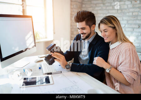 Picture of young attractive designers looking at camera Stock Photo