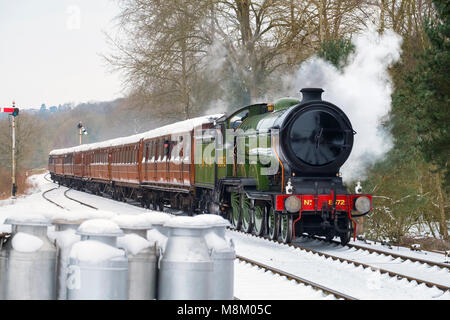 LNER steam locomotive 8572 pulling into Hampton Loade station in snow on the Severn Valley Railway, Shropshire, during the Spring Steam Gala. Stock Photo