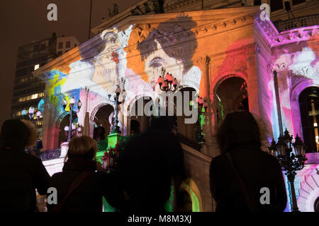 18 March 2018, Germany, Frankfurt am Main: Light installation 'Changing Times' on the facade of the old opera, where the front side of the building is being lit up with different scenarios. The illuminations run until 23 March in Frankfurt and Offenbach. Photo: Fabian Sommer/dpa Stock Photo