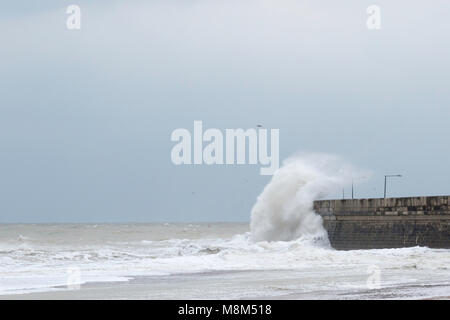 Ramsgate, Kent, UK 18th March, 2018. A large wave hits the harbour arm. Sue Holness Credit: Sue Holness/Alamy Live News Stock Photo