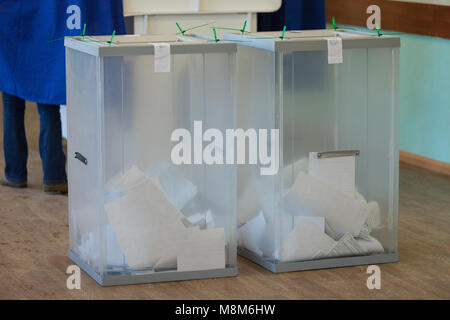MOSCOW, RUSSIA - MARCH 18, 2018: Sealed ballot boxes with ballots at the polling station for the election of the President of the Russian Federation in 2018 Credit: Andrey Yanevich/Alamy Live News Stock Photo