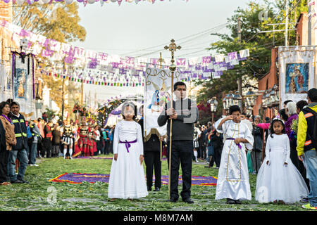 Young children dressed as angels lead the early morning Our Lord of the Column procession marking the start of Holy Week March 18, 2018 in San Miguel de Allende, Mexico. The midnight procession involves a life-sized figure of Christ carried eight miles from Atotonilco to San Miguel on the shoulders of the faithful. Holy week lasts two weeks in the festival central Mexican town. Stock Photo