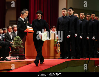 Yokosuka, Japan. 18th Mar, 2018. Graduates of Japan's National Defense Academy receive their diplomas as they graduated the academy in Yokosuka, suburban Tokyo on Sunday, March 18, 2018. Prime Minister Shinzo Abe delivered a speech before cadets graduating the school to argue the development of defense capability on space and cyber area. Credit: Yoshio Tsunoda/AFLO/Alamy Live News Stock Photo