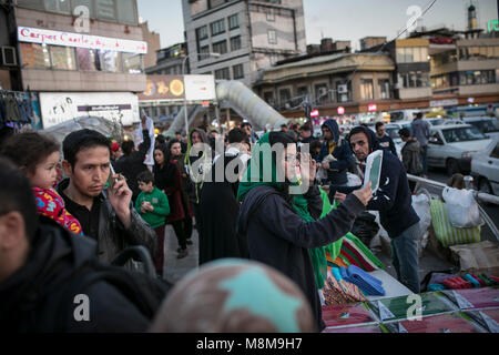 Tehran. 18th Mar, 2018. People shop in Tajrish bazaar in Tehran, Iran, on March 18, 2018, ahead of Nowruz, the Iranian New Year. Nowruz marks the first day of spring and the beginning of the year in Iranian calendar. Credit: Ahmad Halabisaz/Xinhua/Alamy Live News Stock Photo