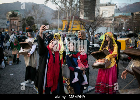 Tehran. 18th Mar, 2018. Women take selfie with sculptures which are symbol of Nowruz in Tajrish bazaar in Tehran, Iran, on March 18, 2018, ahead of Nowruz, the Iranian New Year. Nowruz marks the first day of spring and the beginning of the year in Iranian calendar. Credit: Ahmad Halabisaz/Xinhua/Alamy Live News Stock Photo