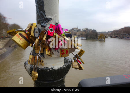 Love locks on the Pont des Arts bridge in Paris, above the river Seine, Paris, France