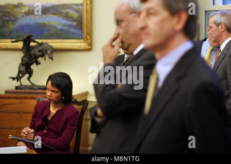 Washington, DC - December 19, 2008 -- United States Secretary of State Condolezza Rice listens as United States President George W. Bush meets with the President Mahmoud Abbas (Abu Mazen) of the Palestinian Authority in the Oval Office of the White House in Washington DC on Friday, December 19, 2008..Credit: Ken Cedeno / Pool via CNP /MediaPunch Stock Photo