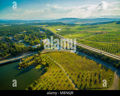 Aerial view of Tuggeranong Parkway passing near National Arboretum in Canberra, Australia Stock Photo