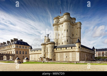 Chateau de Vincennes in Paris. France castle with French national flag under the sunny blue sky. Stock Photo