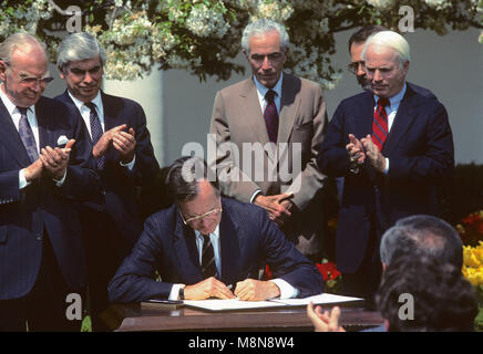 Washington DC., USA, April1, 1989 President  George H.W. Bush signs budget agreement in Rose Garden ceremony with members of the congressional leadership looking on. Credit: Mark Reinstein/MediaPunch Stock Photo