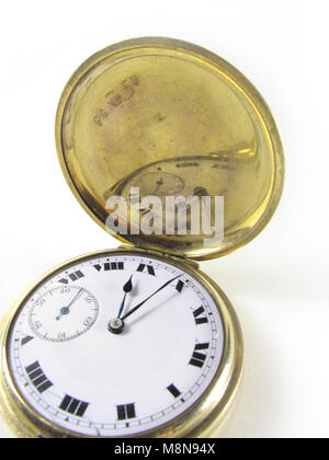 Watch face of an antique gold hunter pocket watch Stock Photo