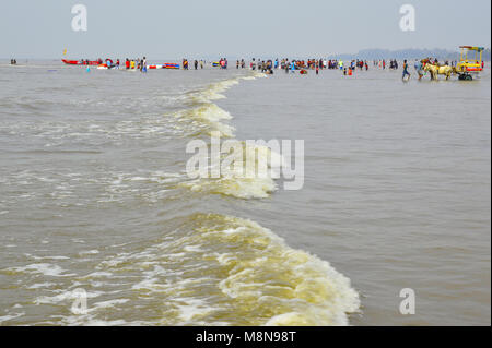 NAGAON BEACH, MAHARASHTRA, INDIA 13 JAN 2018. Tourists enjoy walking, swimming and various activities at the Nagaon beach Stock Photo