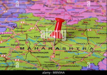 Close view of Pushpin pointing to Maharashtra on a map of India Stock Photo