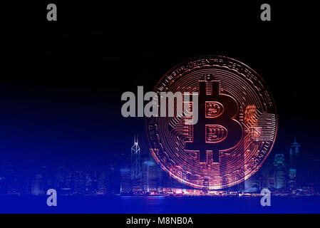 Double exposure bitcoin digital currency, bit-coin on motherboard or with chips on city background, Cryptocurrency money concept idea. Stock Photo