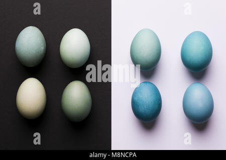 Happy Easter black and white background. Hand painted blue Easter eggs abstract minimal concept. Stock Photo