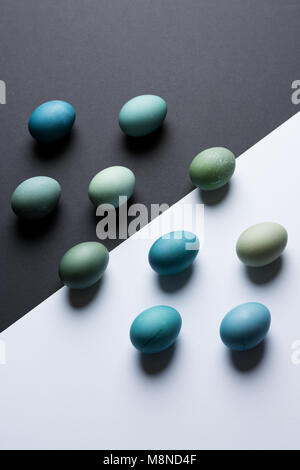 Happy Easter black and white background. Hand painted blue Easter eggs abstract minimal concept. Stock Photo