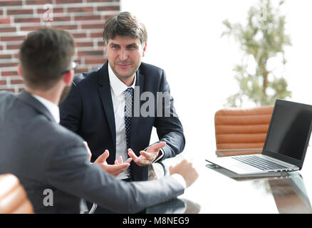 Happy business partners working with documents Stock Photo