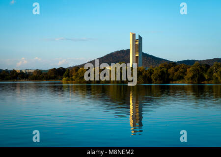 National Carillon, Canberra reflecting into a calm Lake Burley Griffin in the late afternoon sunshine. Stock Photo