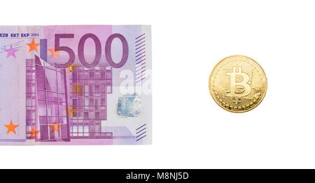 500 Euro gold and bitcoin on a white background. The concept of business and Finance. Stock Photo