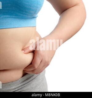Overweight woman holding the fat around her waist. Stock Photo