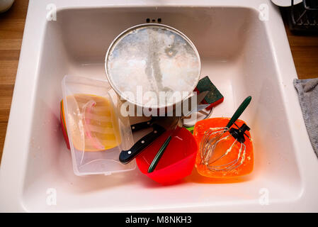 Unwashed dishes in sink close Stock Photo