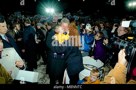 Ann Arbor, Michigan, USA, October 19, 1992 Presidential candidate Governor William Clinton arrives at the University of Michigan at Ann Arbor for the final debate with the incumbent President George H.W. Bush  and pauses to hold another baby. Credit: Mark Reinstein/MediaPunch Stock Photo
