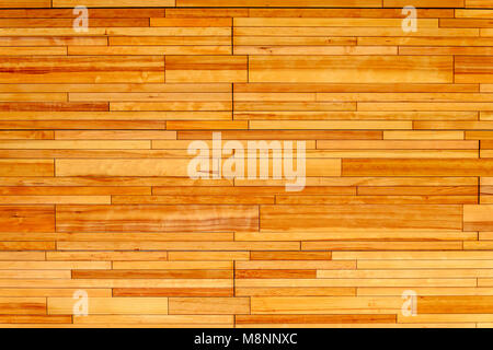 Wooden wall made of rectangular pieces of light wood, varnished Stock Photo