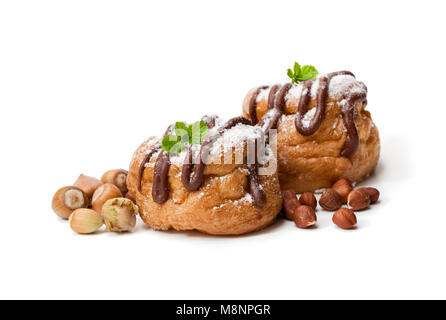 Belgian  chocolate choux buns stuffed whith hazelnut cream isolated on white Stock Photo