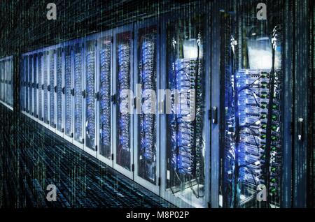 Network cabinets with server racks in a data center with matrix. | usage worldwide Stock Photo