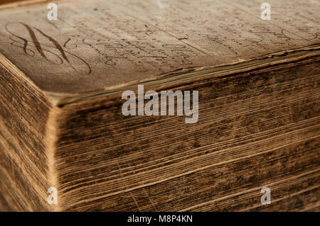 Close up of a bible handed from father to son from the 1760s. Blank pages are gradually filled with hand-written information about family milestones. Stock Photo